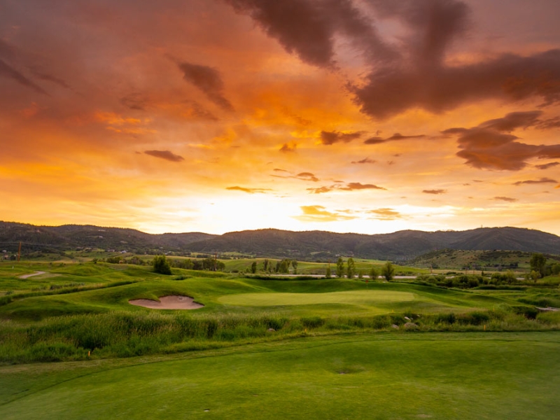Golf hole at sunset